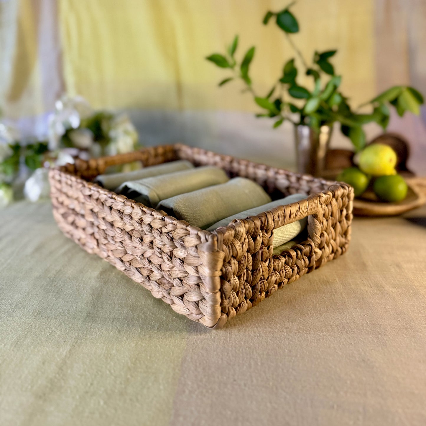 Handwoven Water Hyacinth basket with Handles holding napkins