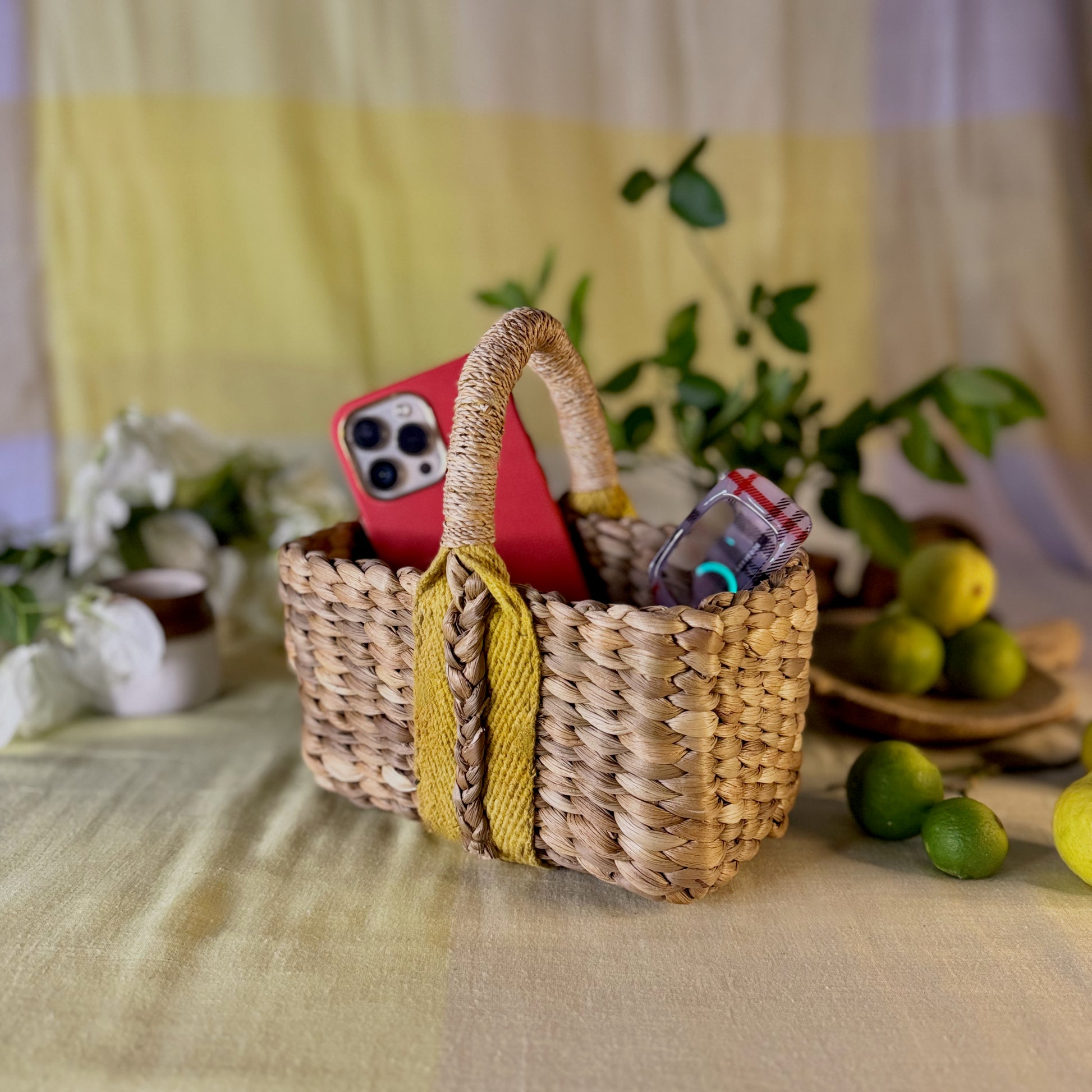 Boxy water hyacinth and banana fiber handbag basket with phone and glasses